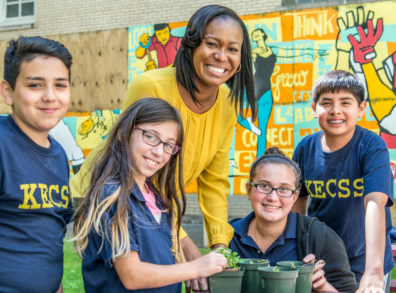 GSE student smiling while working with children