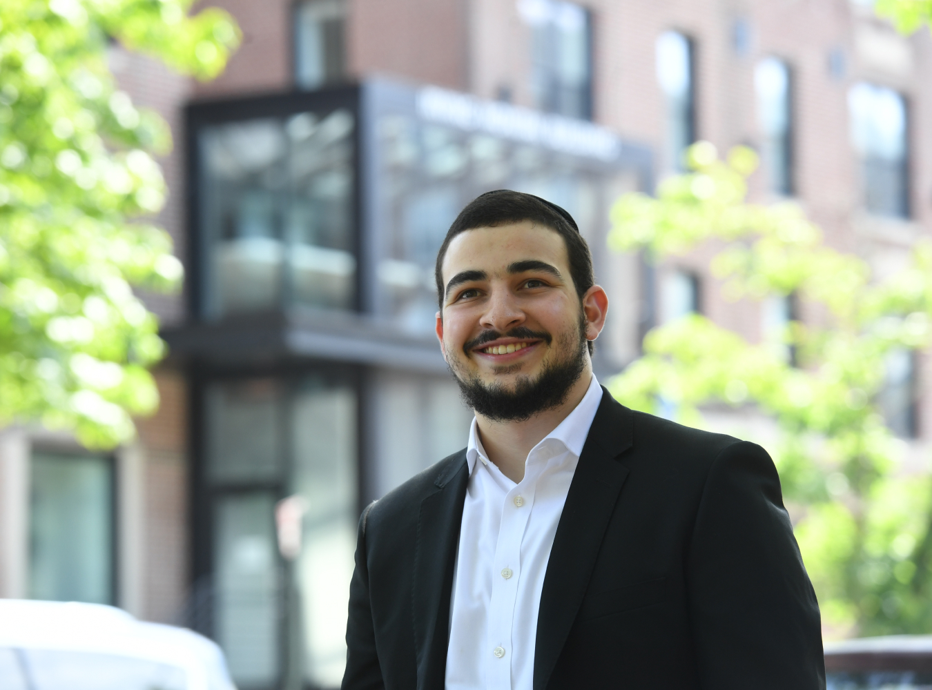 Student smiling in front on window