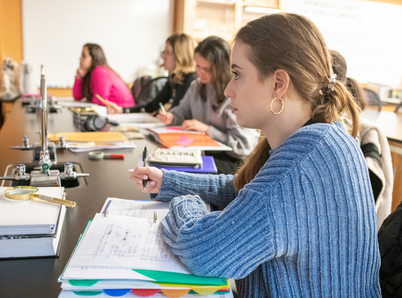 Students taking notes in classroom