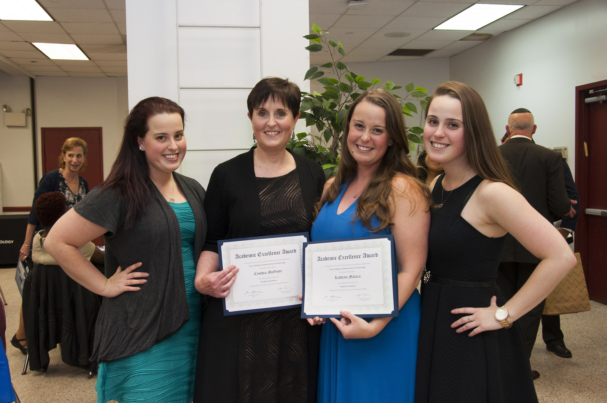 Mother-daughter duo Cynthia McGinty (second from left) and Kathryn Malara (second from right), who both won Information Technology Program Academic Excellence Awards, with Ms. McGinty's other daughters. 