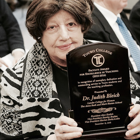 Dr. Judith Bleich, of the Lander College for Women—The Anna Ruth and Mark Hasten School, holds her award for teaching excellence during the December award ceremony. 