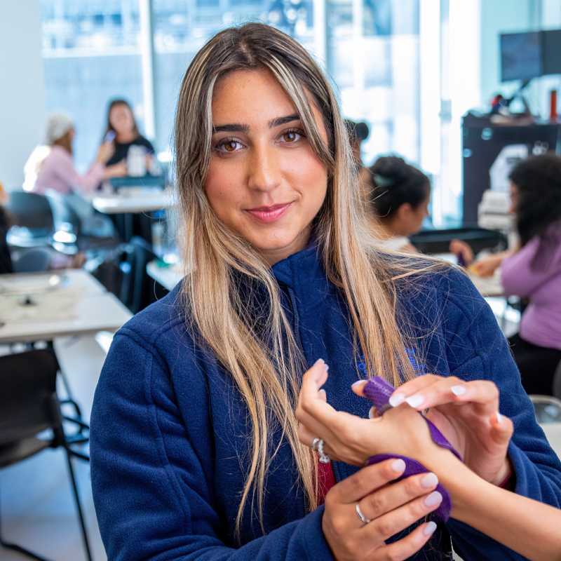 Sarah Iskhakov practicing hand therapy in splinting class.