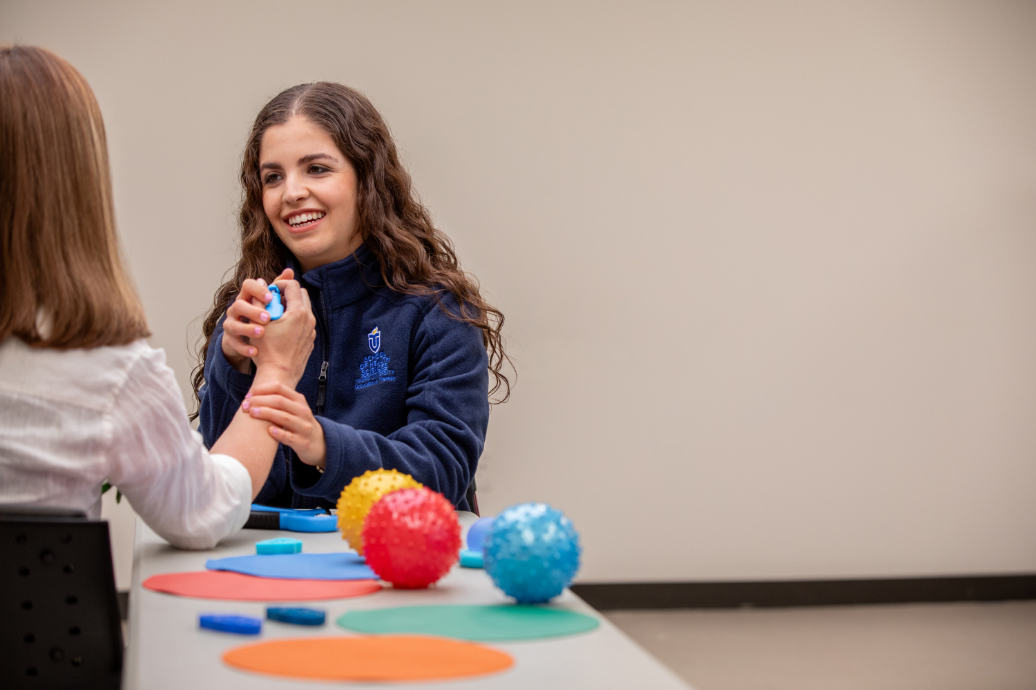 Sarit Scher practicing hand therapy